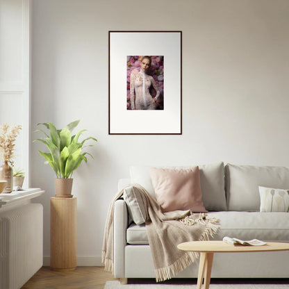 Framed artistic photograph of a nude figure surrounded by pink floral elements.