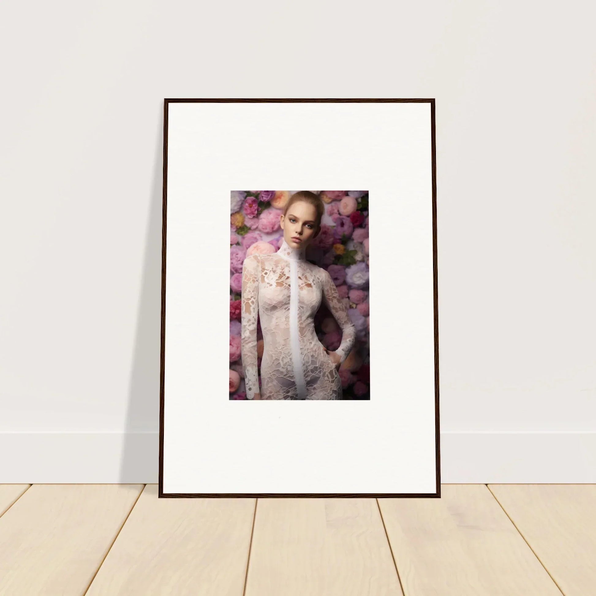 Framed portrait photograph of a woman in a lacy white outfit against a floral background.