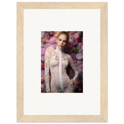 Framed photograph of a woman in a lace dress surrounded by pink flowers.