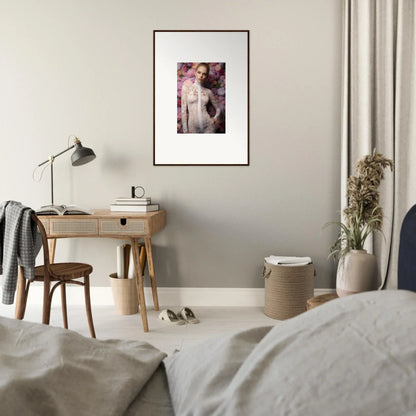 Framed artistic print of a nude figure surrounded by floral elements.