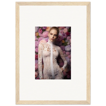 Framed photograph of a woman wearing a delicate lace garment surrounded by pink floral elements.