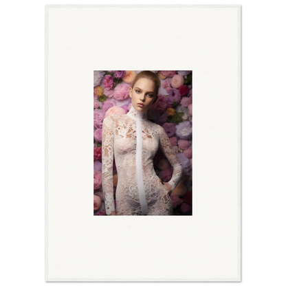 Portrait of a woman in a delicate white lace dress against a floral backdrop.