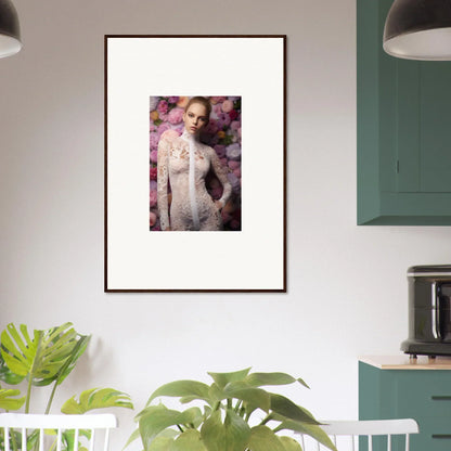 Framed portrait of a woman in a white lace outfit against a floral background.