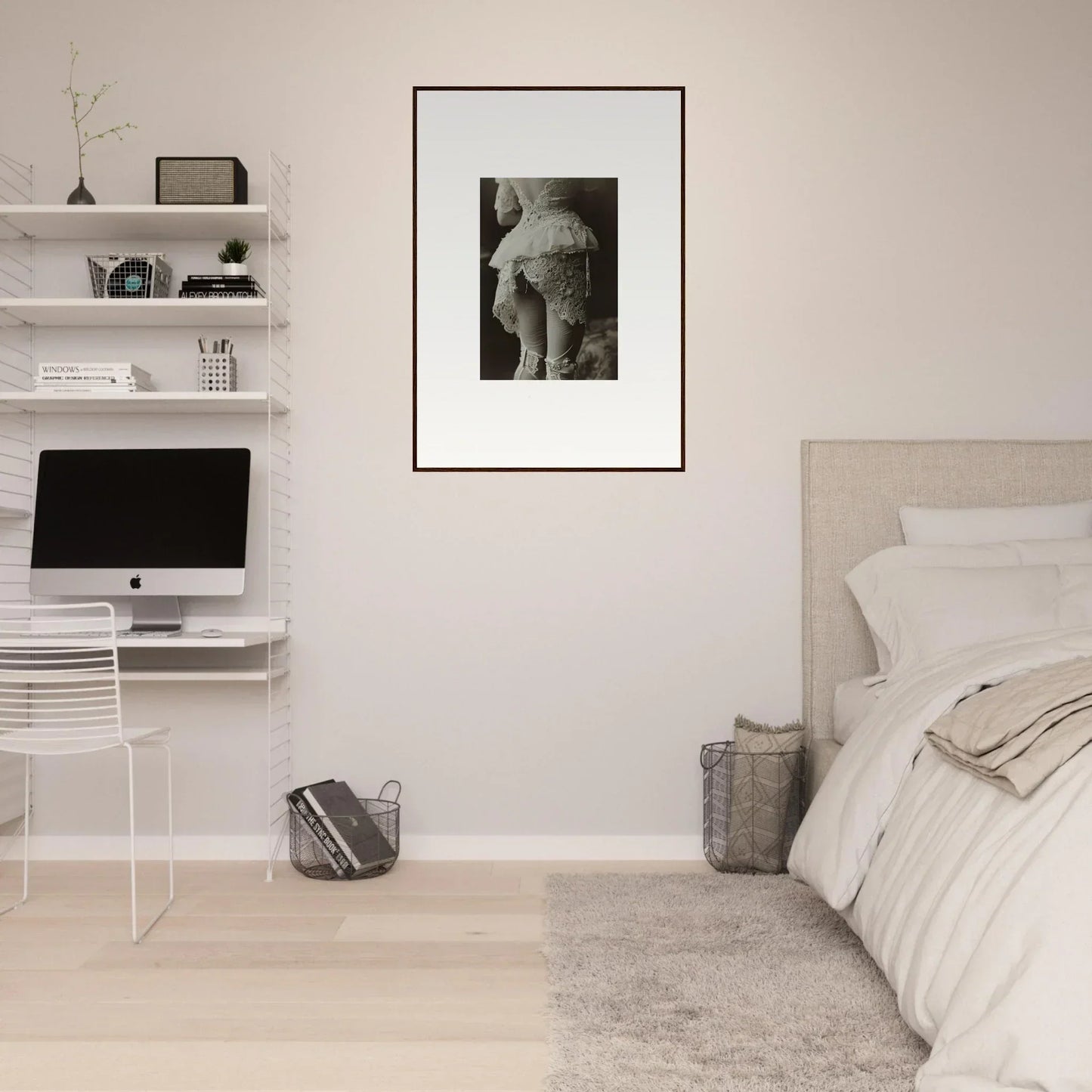 Minimalist bedroom showcasing a framed black and white canvas print as wall art centerpiece