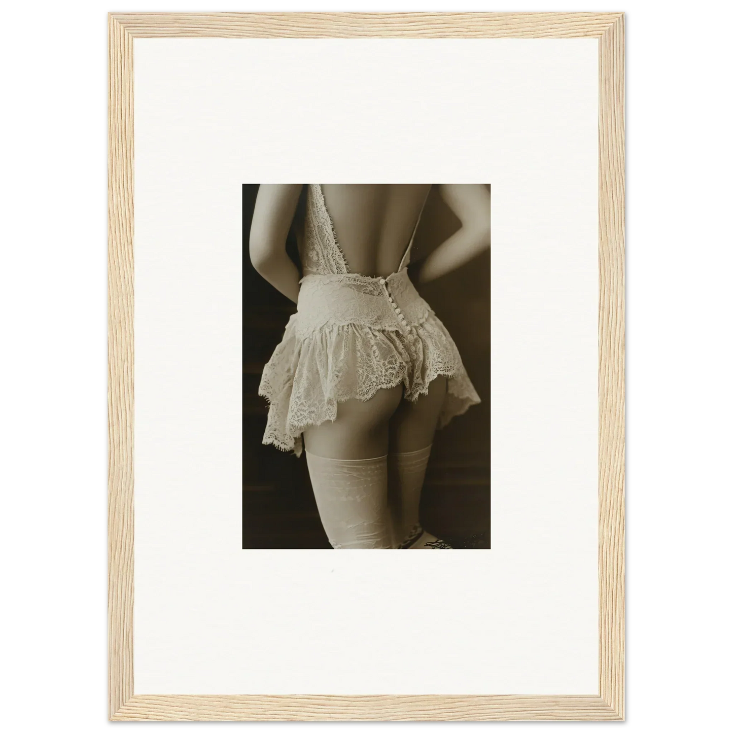 Framed canvas print of a woman in white lace lingerie for chic room decoration