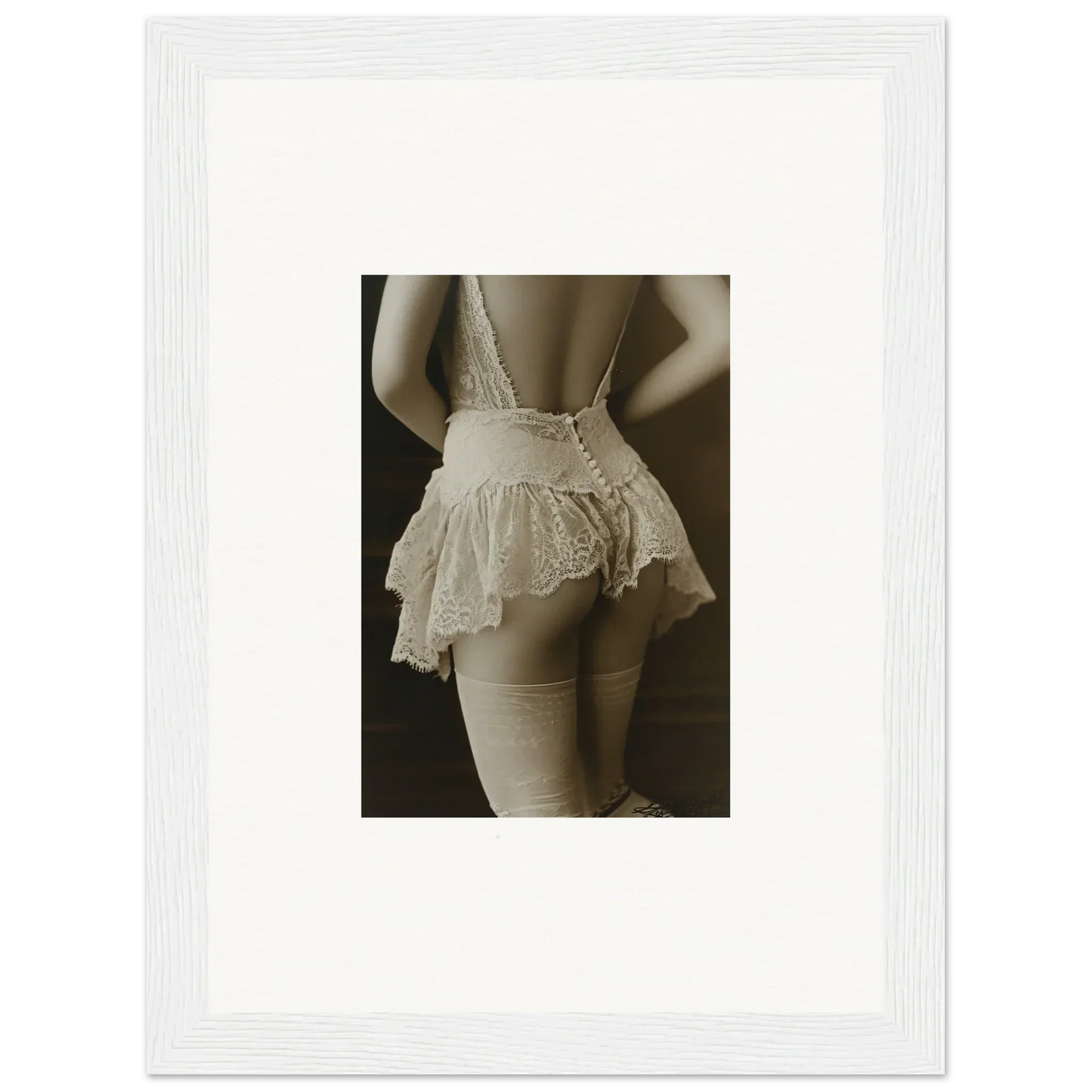 Framed canvas print of a woman’s torso in laced prism white lingerie for room decoration