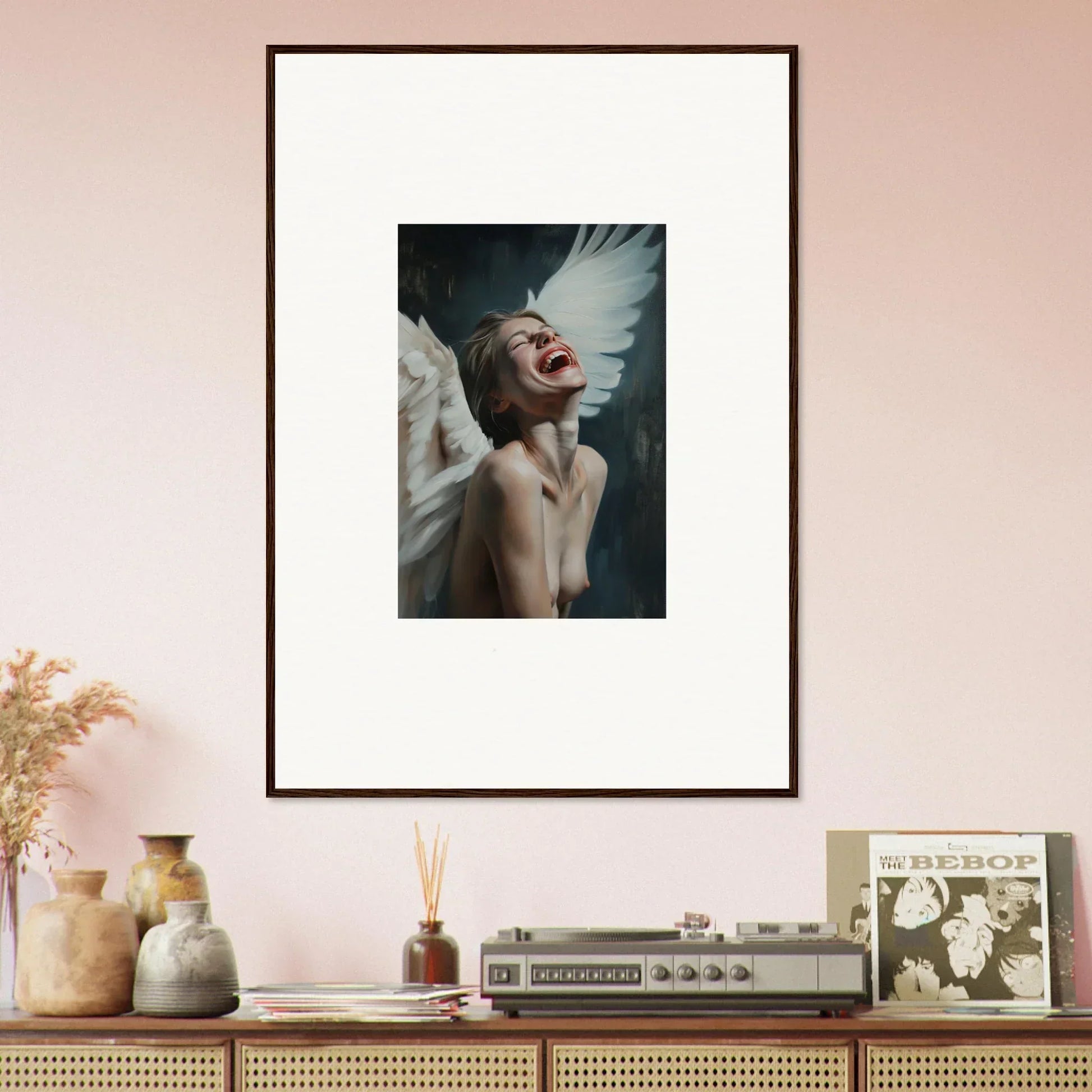 Framed wall art of a figure with white wings for stylish room decoration