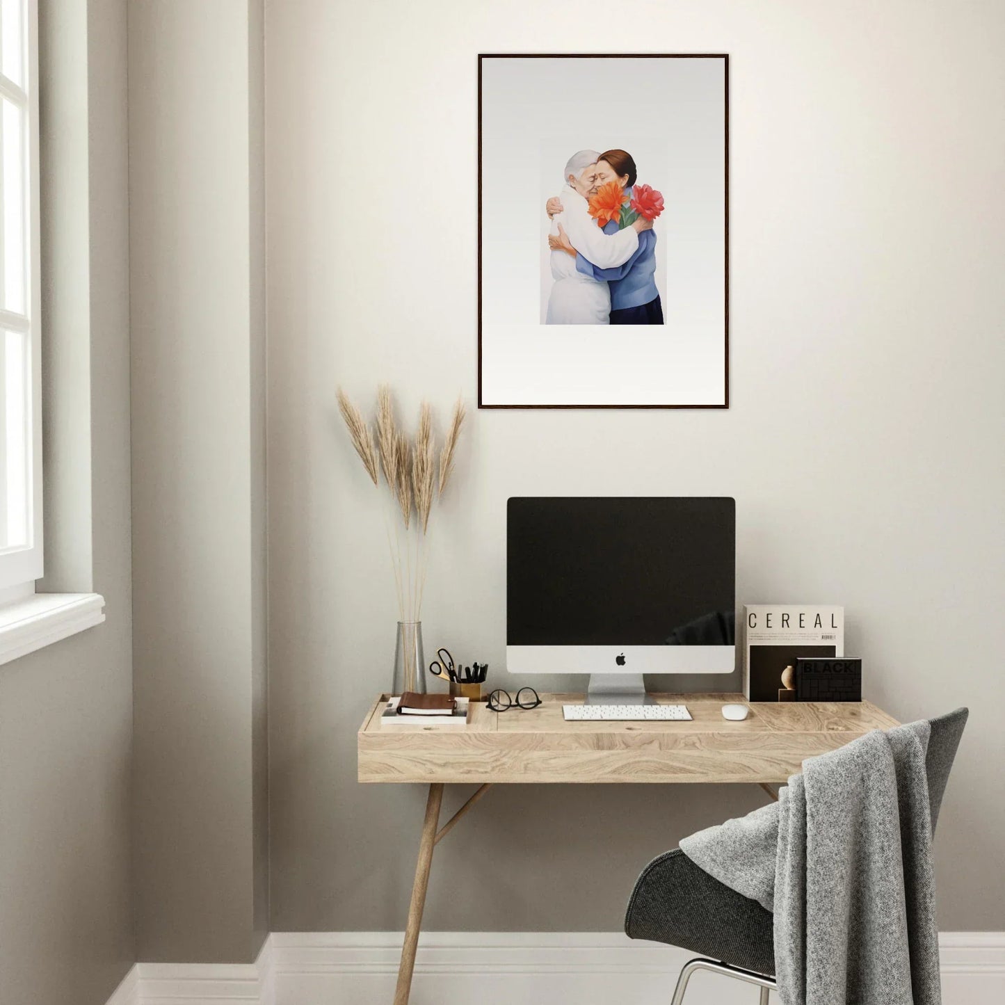 Framed wall art of two people embracing above a desk, perfect for room decor