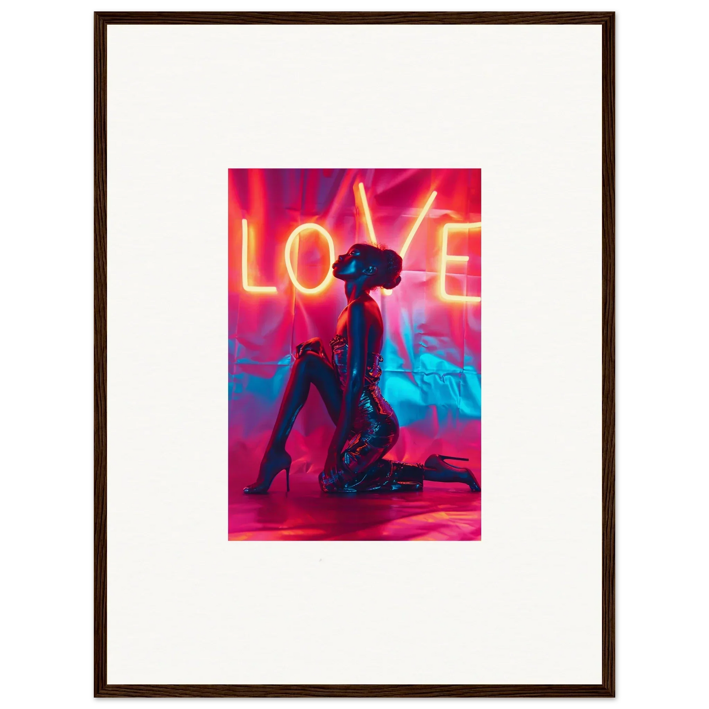 Framed wall art of a silhouetted figure under neon LOVE text for stylish room decoration