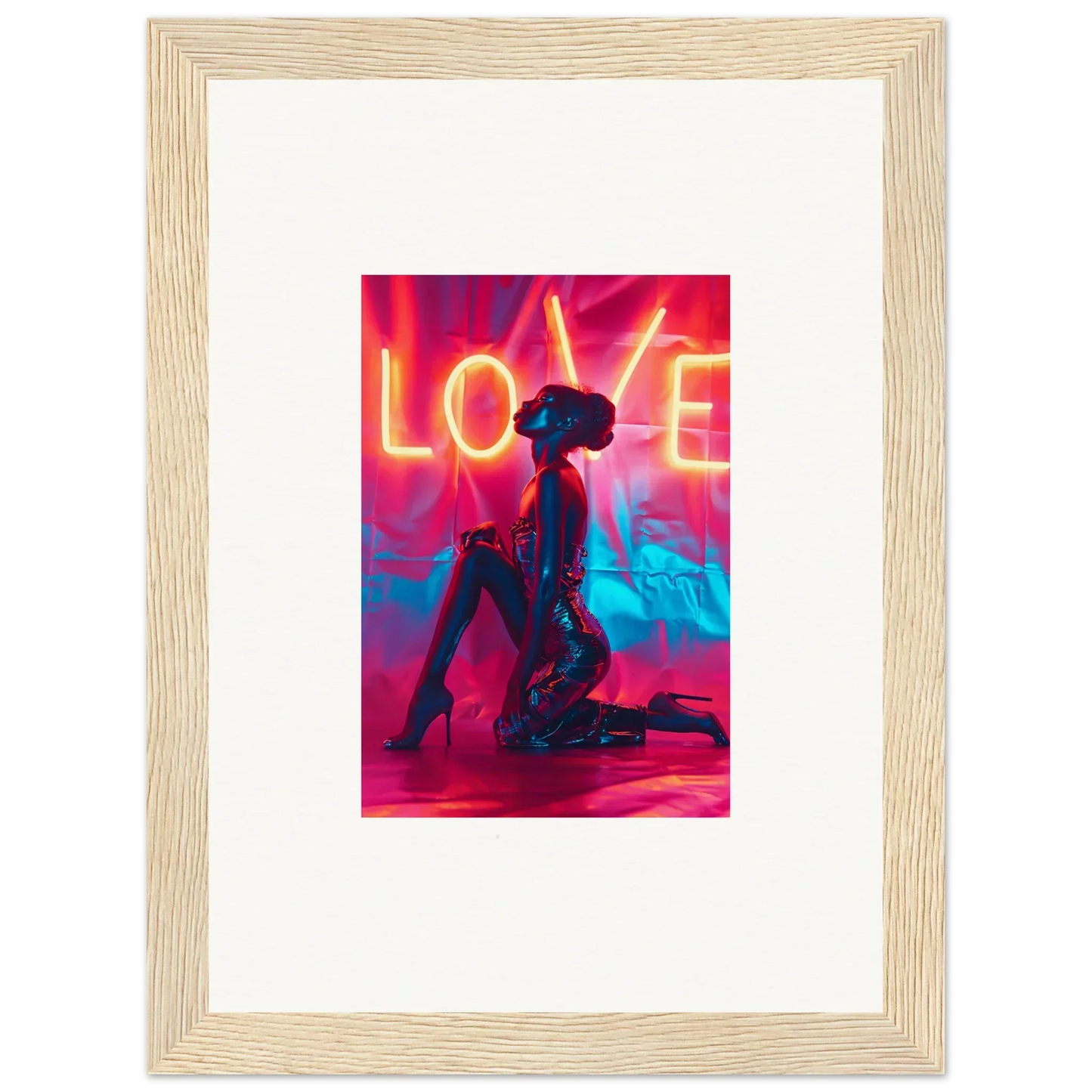 Framed canvas print of neon LOVE text with a silhouetted figure for trendy room decoration