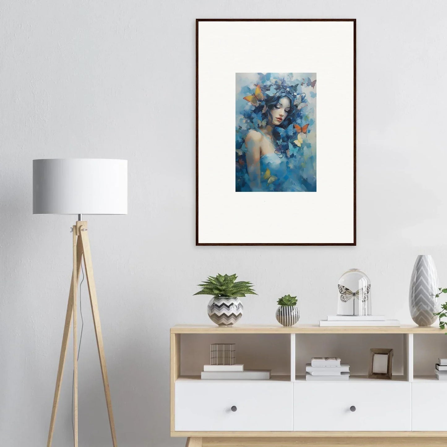 Framed wall art of a dreamy blue portrait with butterflies for elegant room decor