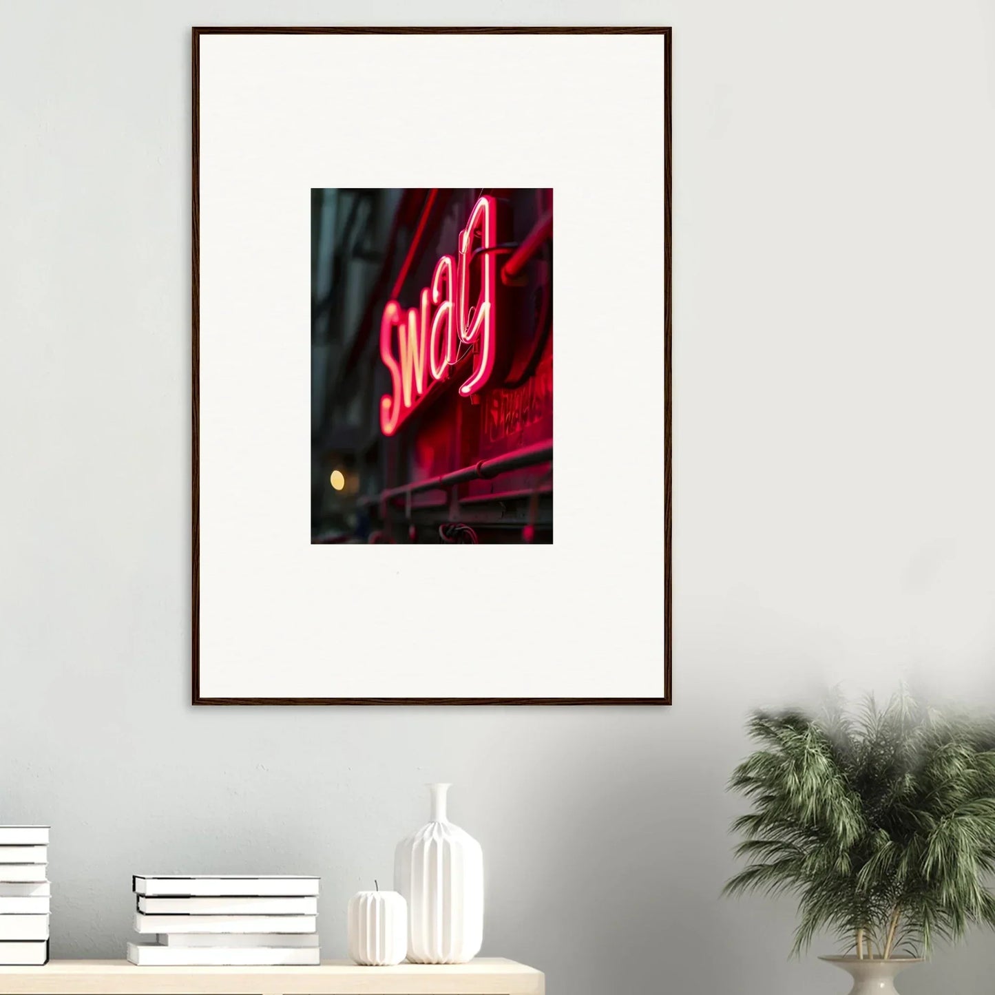 Framed wall art of a glowing red neon Swag sign for vibrant night room decor