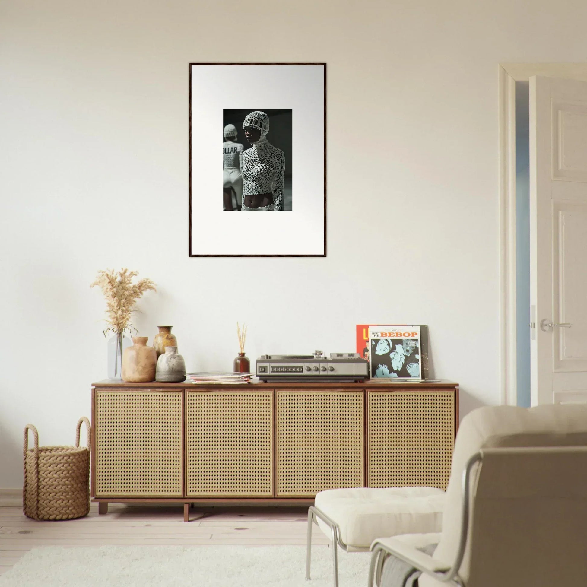 Wooden sideboard with cane-webbed doors and decorative items on top.