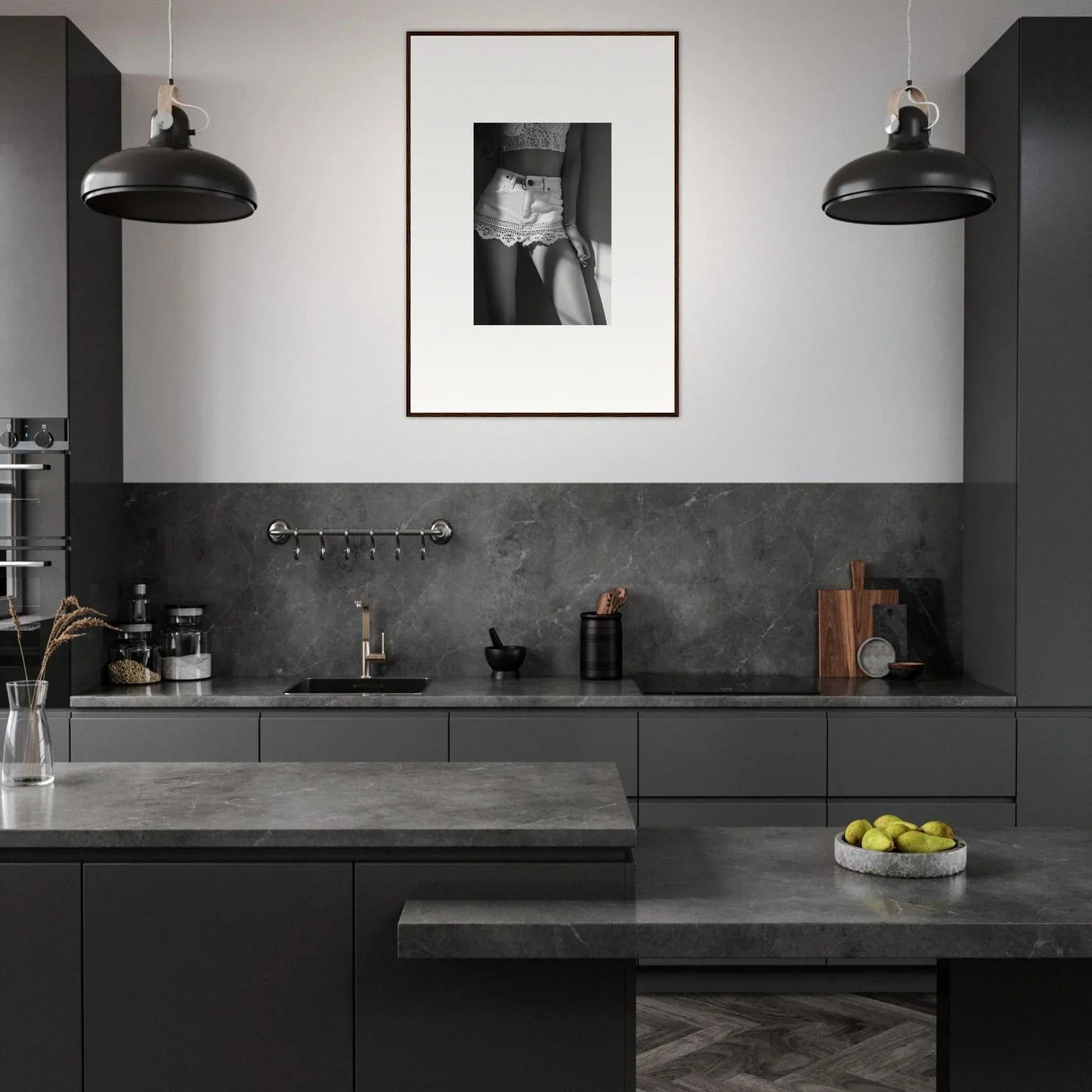 Modern kitchen with dark gray cabinetry and countertops.