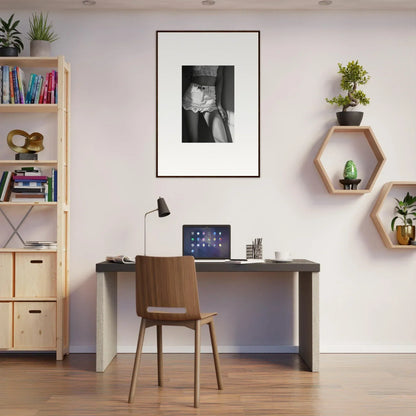 Home office workspace with a desk, chair, and wall decorations.