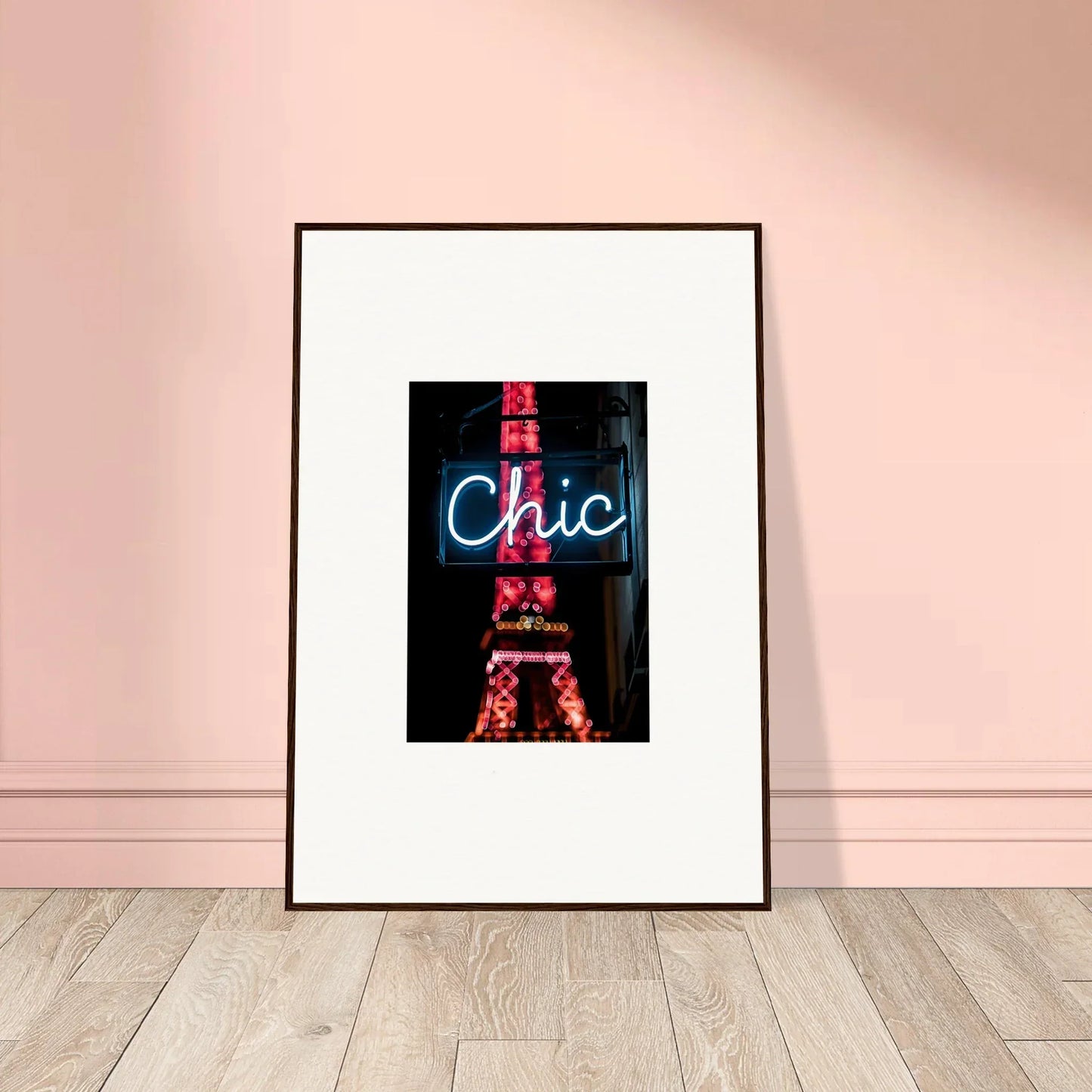 Framed wall art of a neon Chic sign with Eiffel Tower silhouette for Paris dreams decor