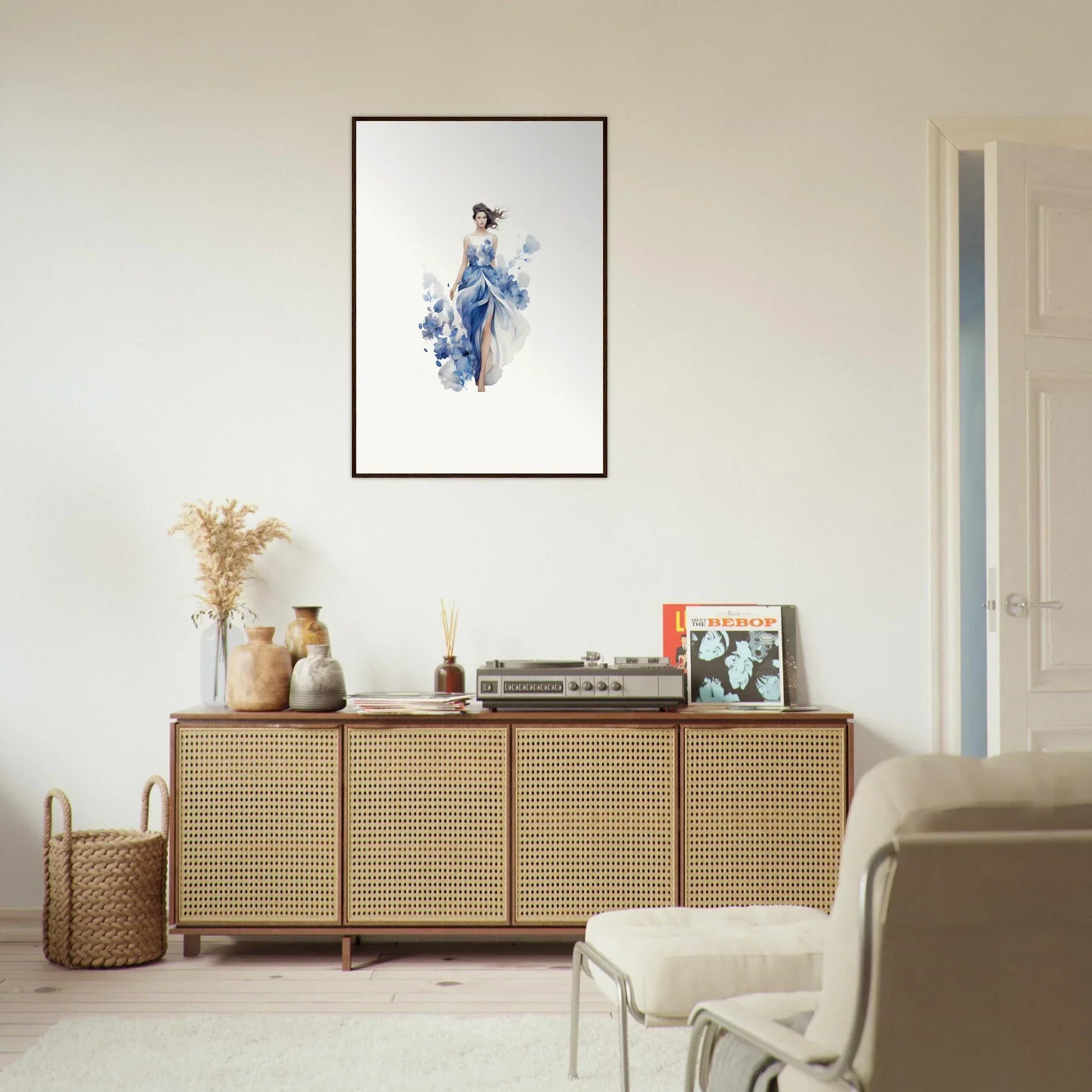 Rattan-fronted wooden sideboard with art symphony canvas print and decorative items