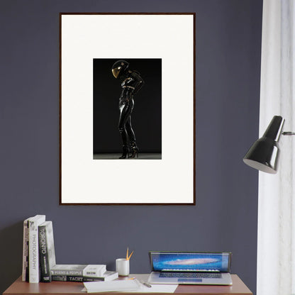 Framed black and white photograph of a silhouetted figure in a dramatic pose.