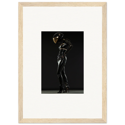 Sleek black latex-clad figure posing dramatically against a dark background.