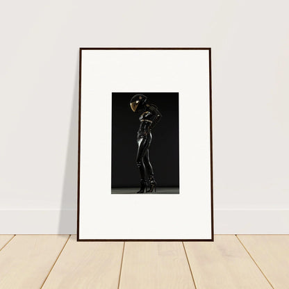 Framed black and white photograph of a silhouetted figure in a dramatic pose.