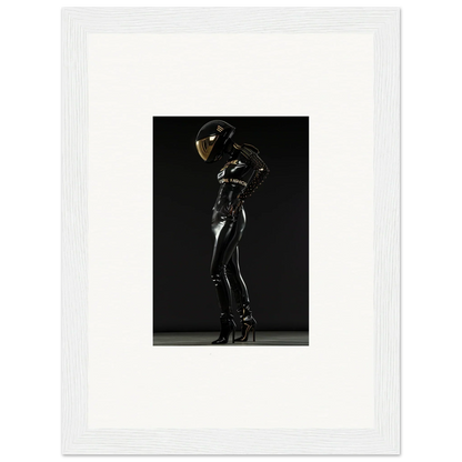 Sleek black latex or leather bodysuit with a reflective helmet, posed dramatically.