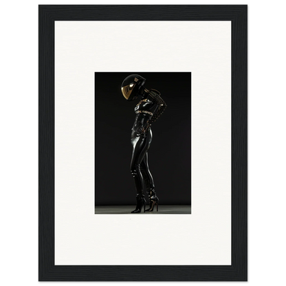 Shiny black latex or rubber bodysuit with a reflective helmet worn by a figure in a dramatic pose.