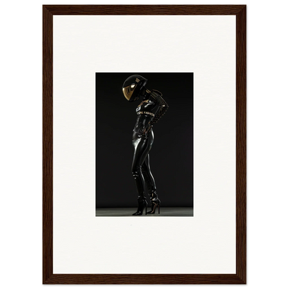 Sleek black latex or rubber bodysuit with a reflective helmet, posed dramatically.