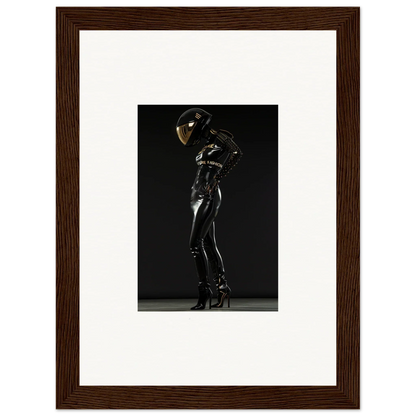 Sleek black latex or rubber bodysuit with a reflective helmet worn by a figure in a dramatic pose.