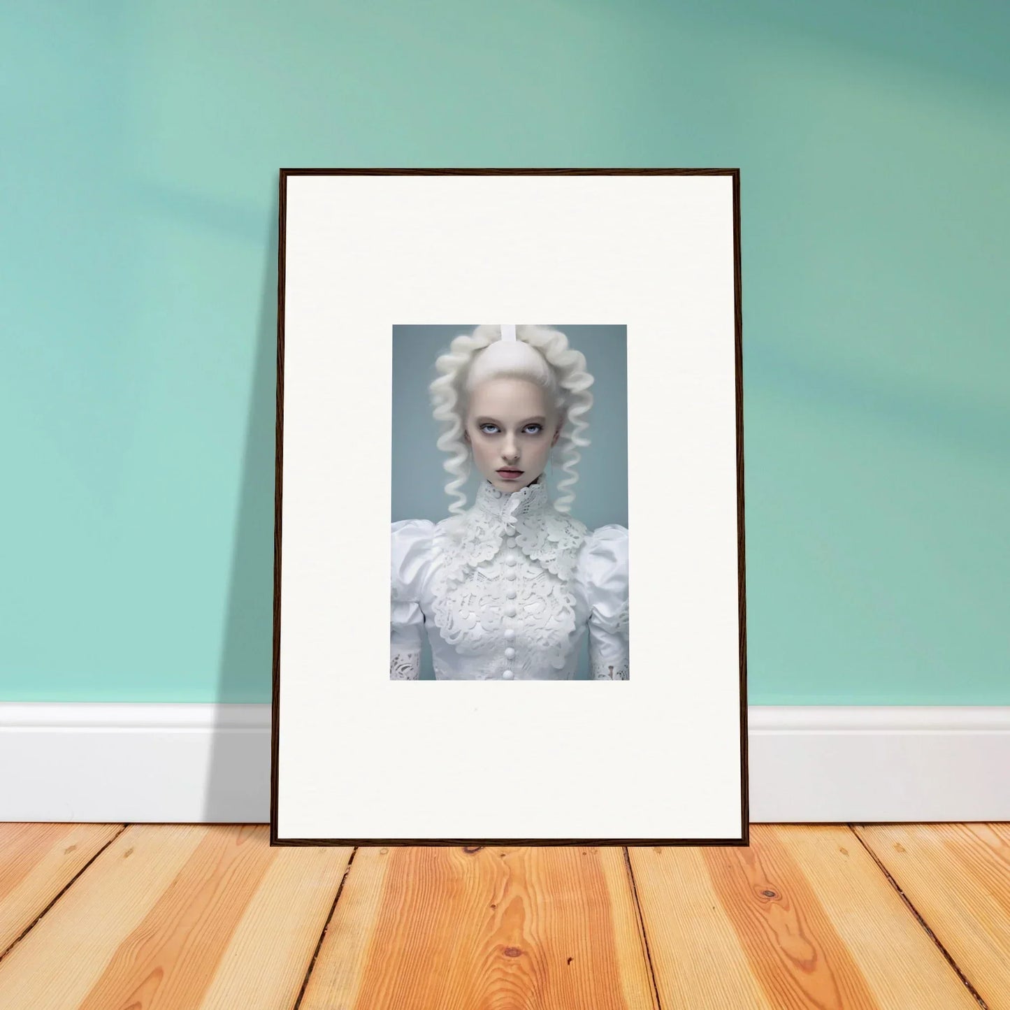 Framed portrait of a person with pale skin and white hair wearing an ornate white outfit.