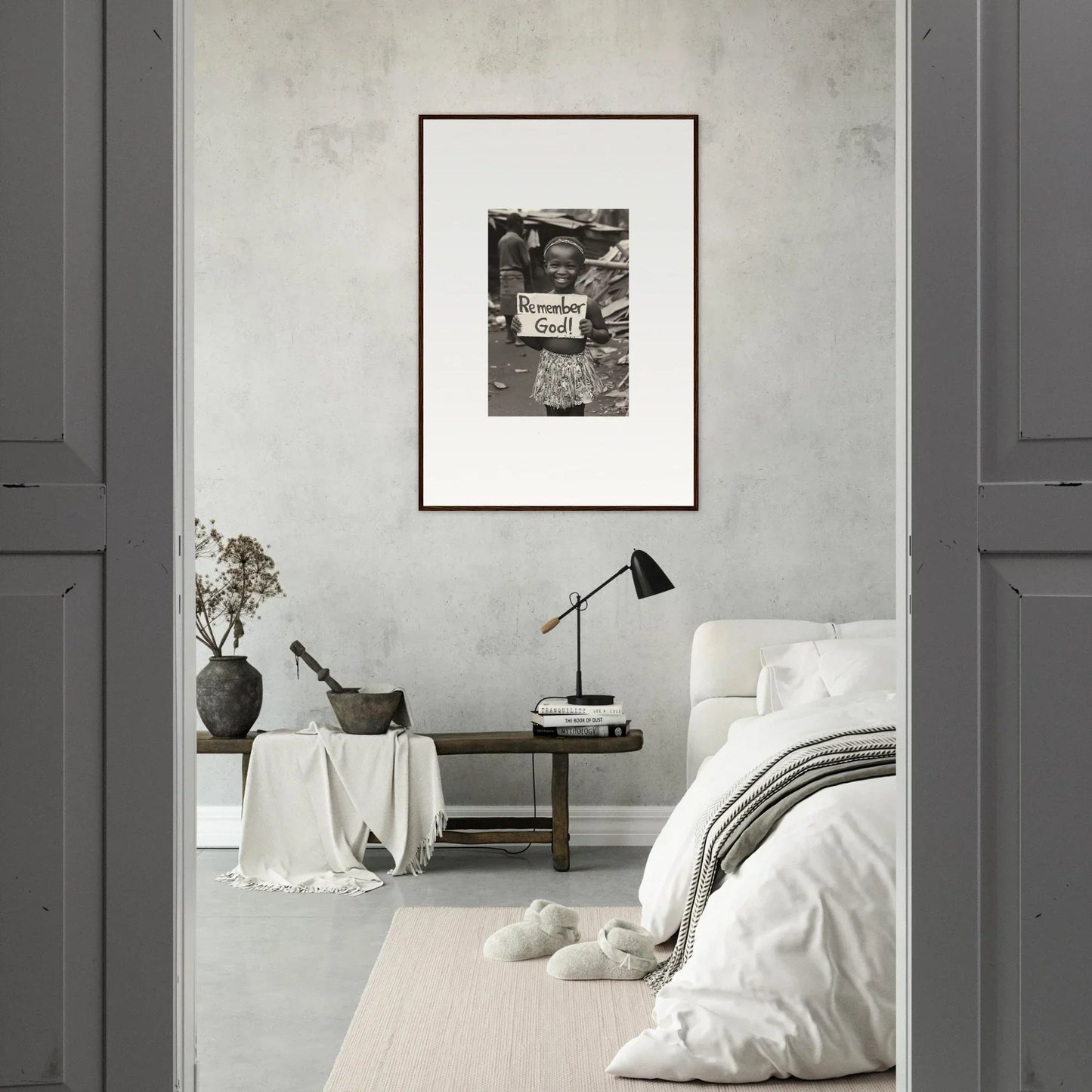 Minimalist bedroom featuring premium framed wall art on a light gray wall