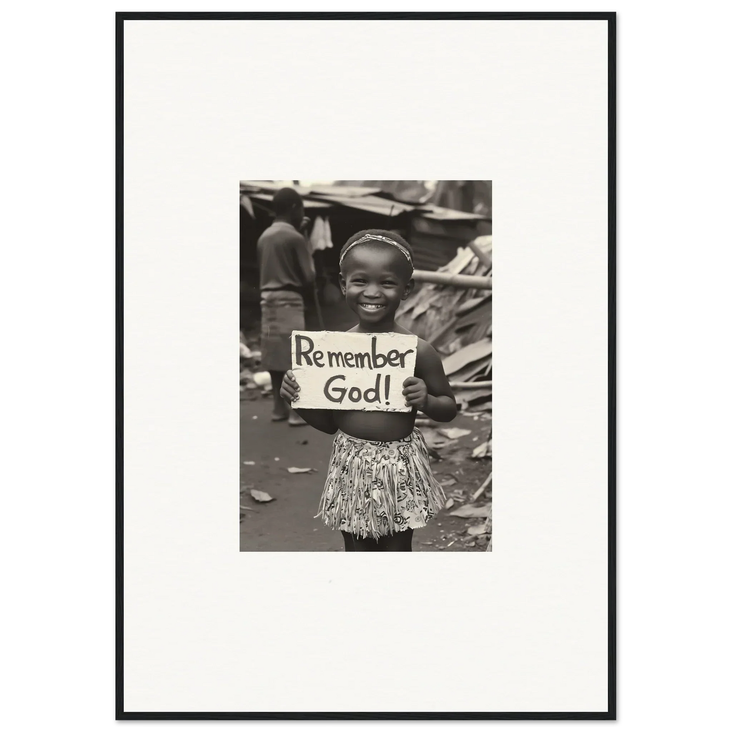 Black and white photo of a person with a Remember God sign for premium framed wall art