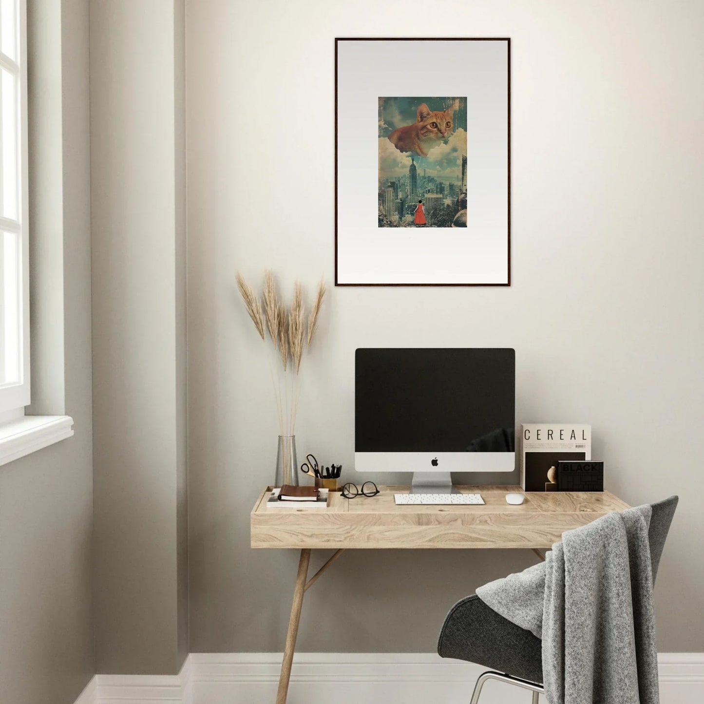 Minimalist wooden desk with computer monitor and framed wall art for stylish room decor