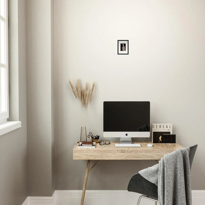 Wooden desk with computer monitor and minimalist decor for stylish room decor