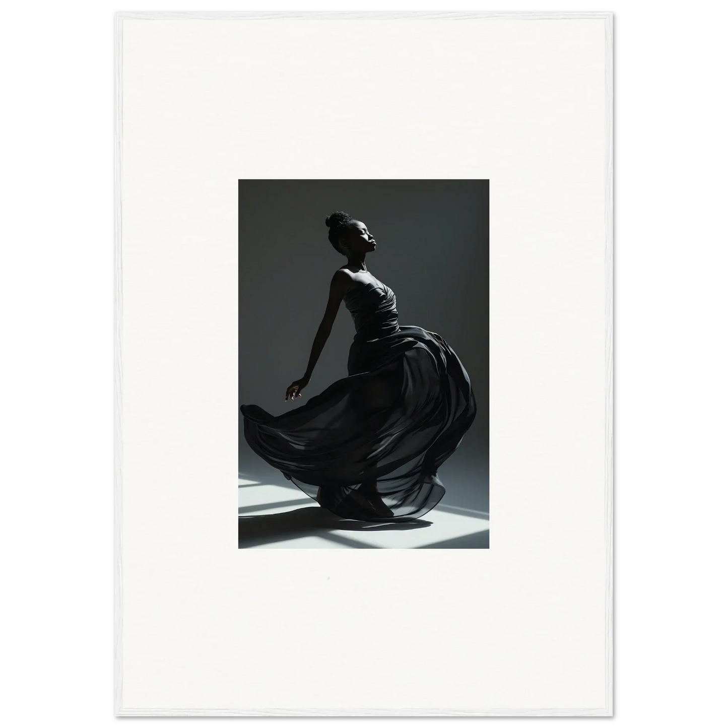 Elegant dancer in a flowing black dress captured mid-movement.