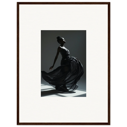 Framed black-and-white photograph of a woman in a flowing dress, captured mid-motion.