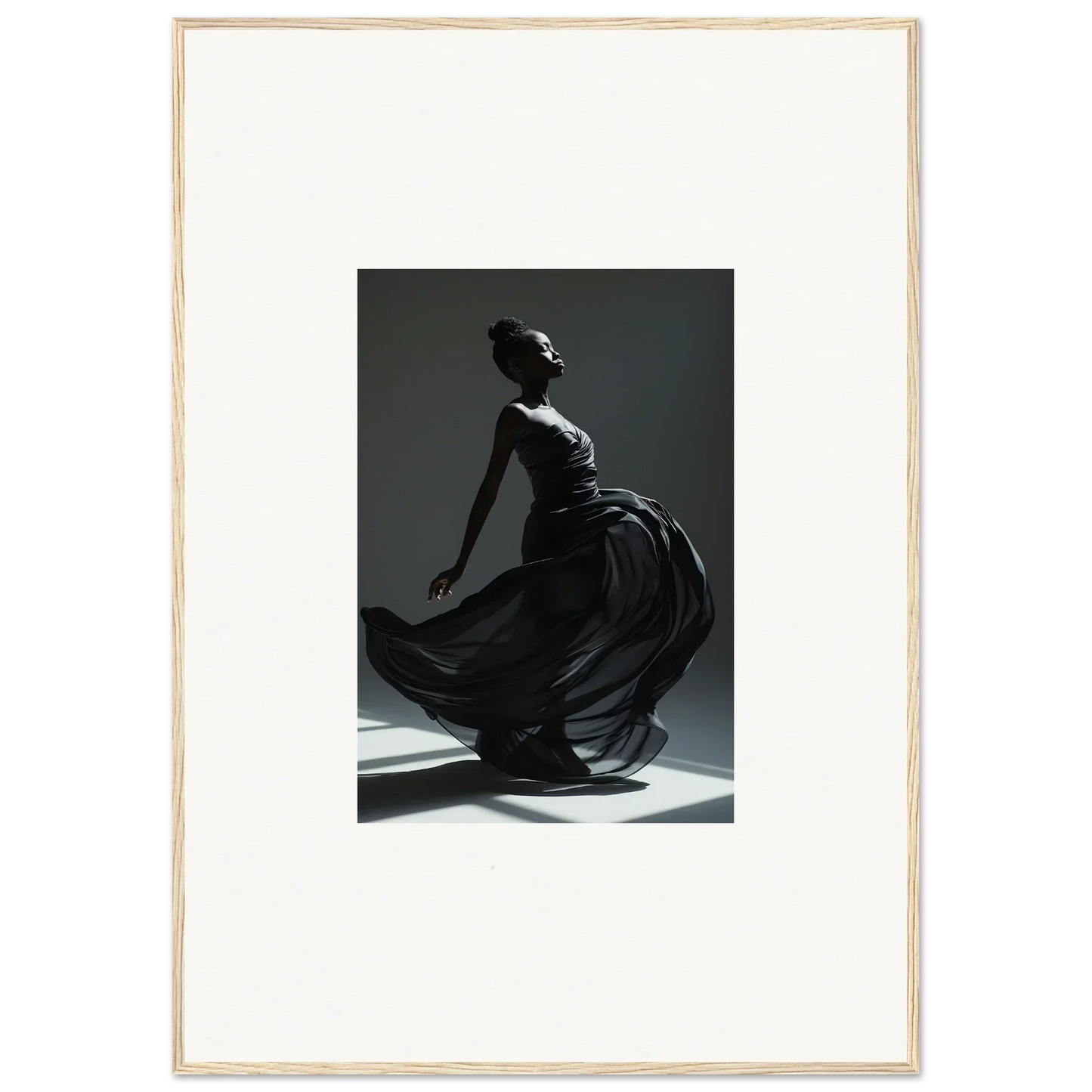 Elegant silhouette of a dancer in a flowing dress, captured mid-movement against dramatic lighting.