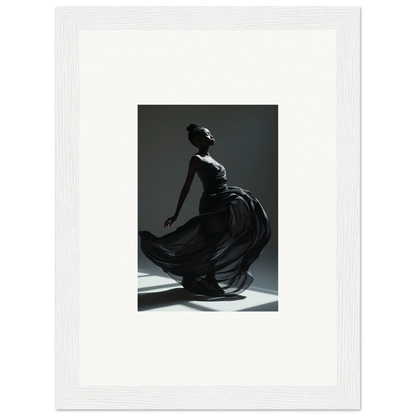 Graceful dancer in a flowing black dress captured mid-movement against a dark background.