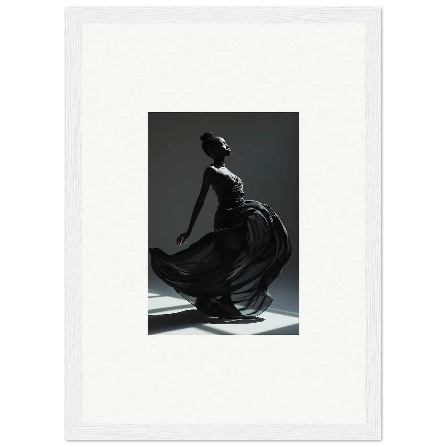 Graceful dancer in a flowing dress captured mid-movement against a dark background.