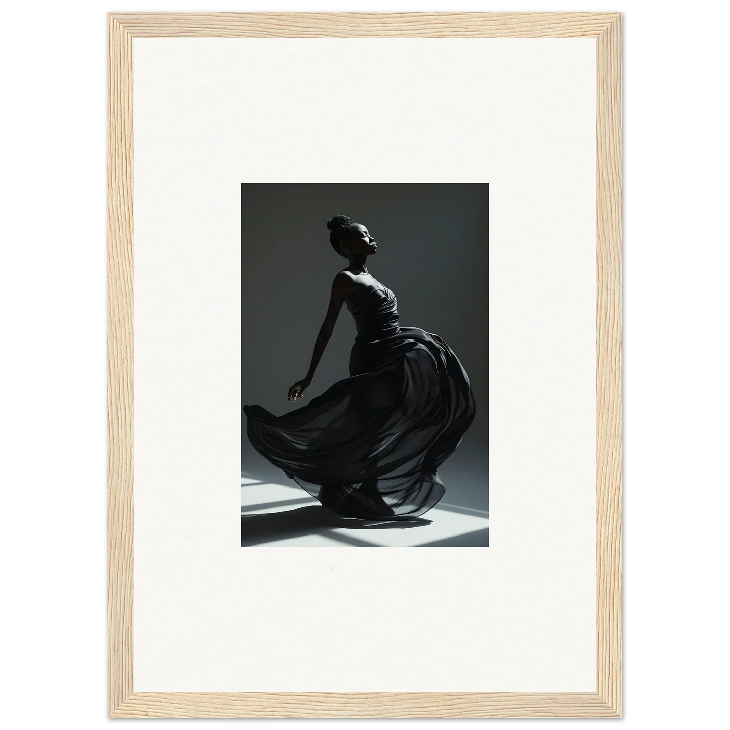 Graceful dancer in a flowing black dress captured mid-movement.