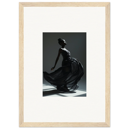 Graceful dancer in a flowing black dress captured mid-movement.