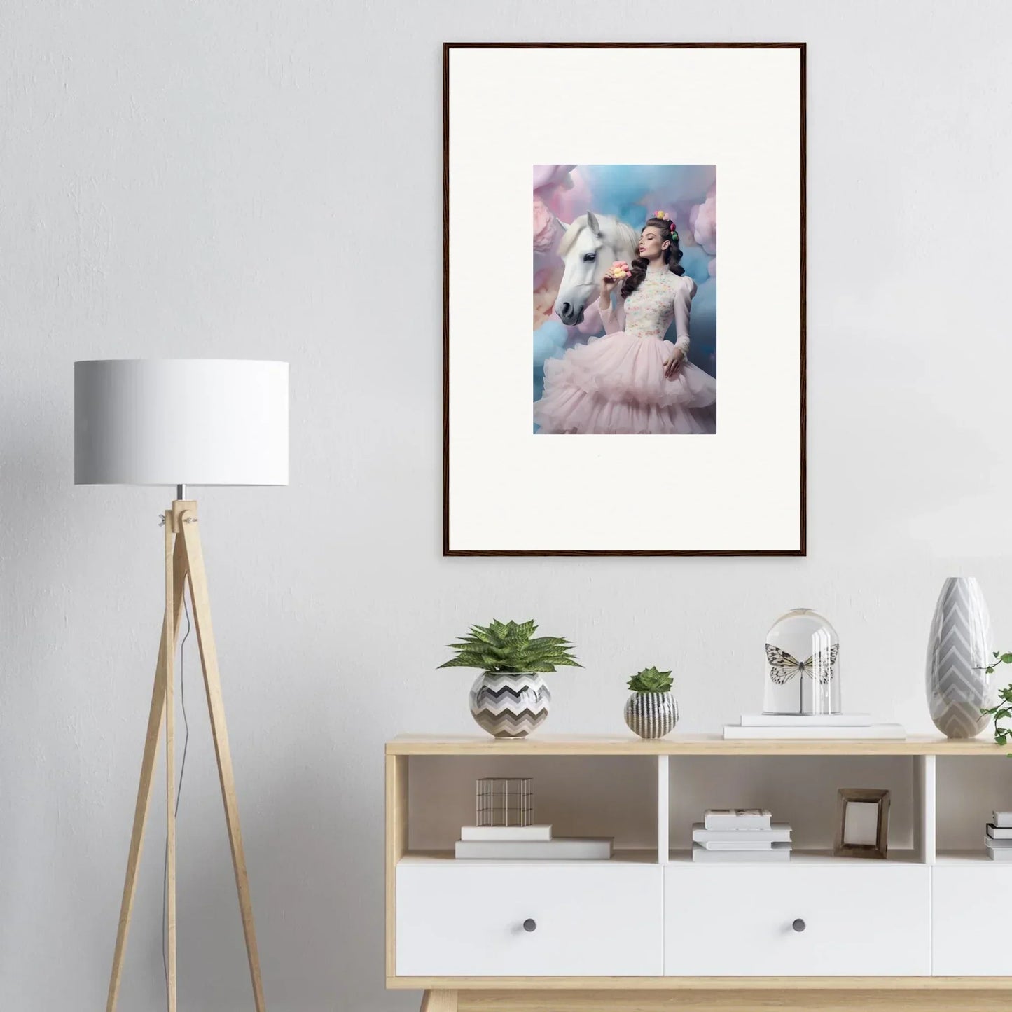 Framed artwork depicting a person with a white horse in a dreamy, pastel-colored setting.