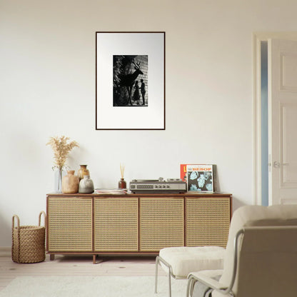 Wooden sideboard with cane-webbed doors and decorative items on top.