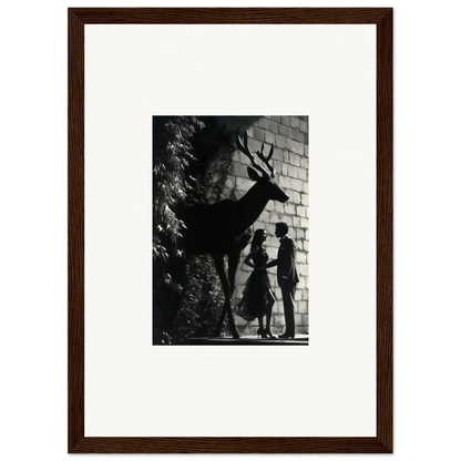 Black and white photograph of silhouettes depicting a deer and two human figures against a wall.