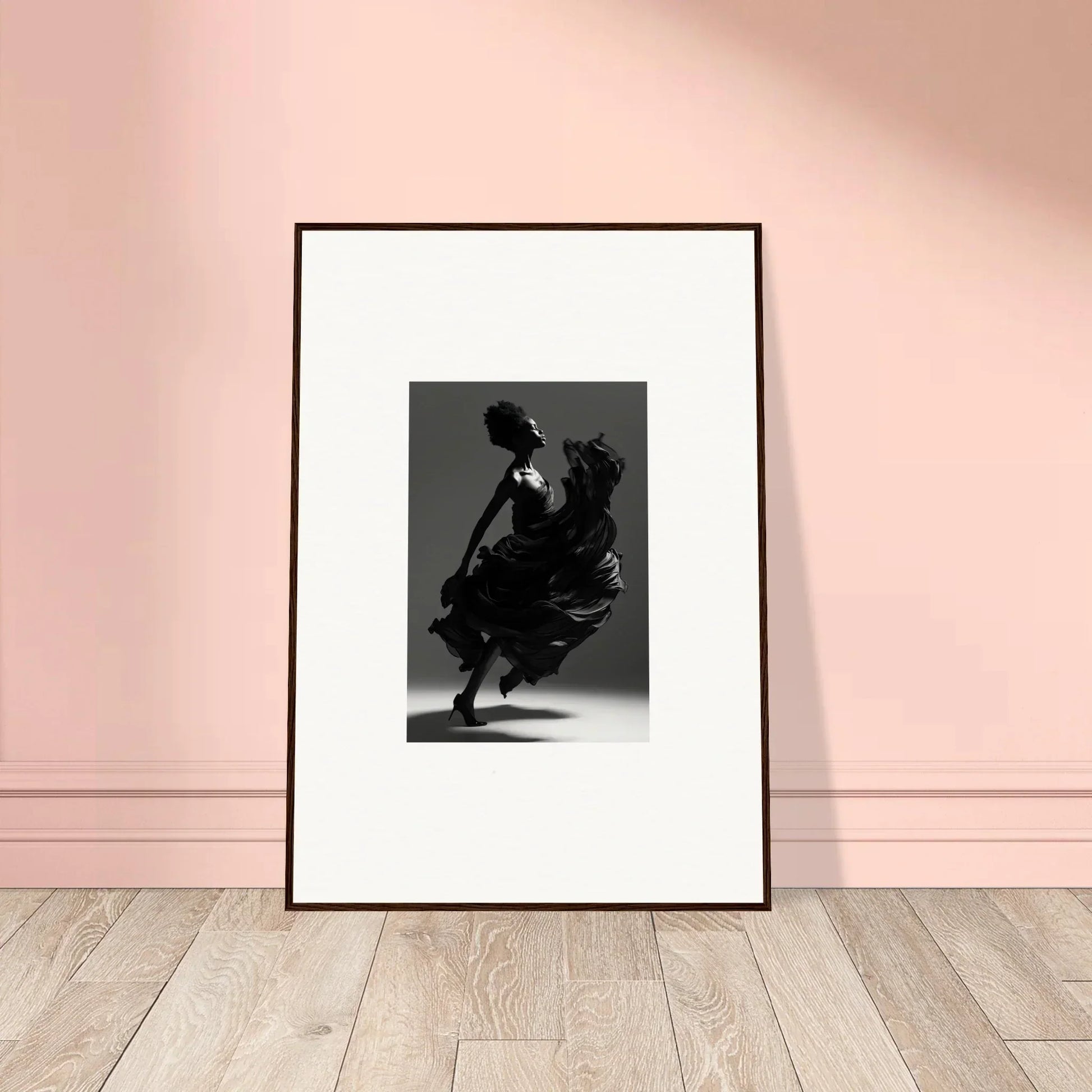 Framed black-and-white photograph of a dancer in motion wearing a flowing dress.