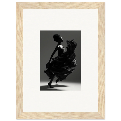 Silhouette of a dancer in a flowing dress captured mid-movement.