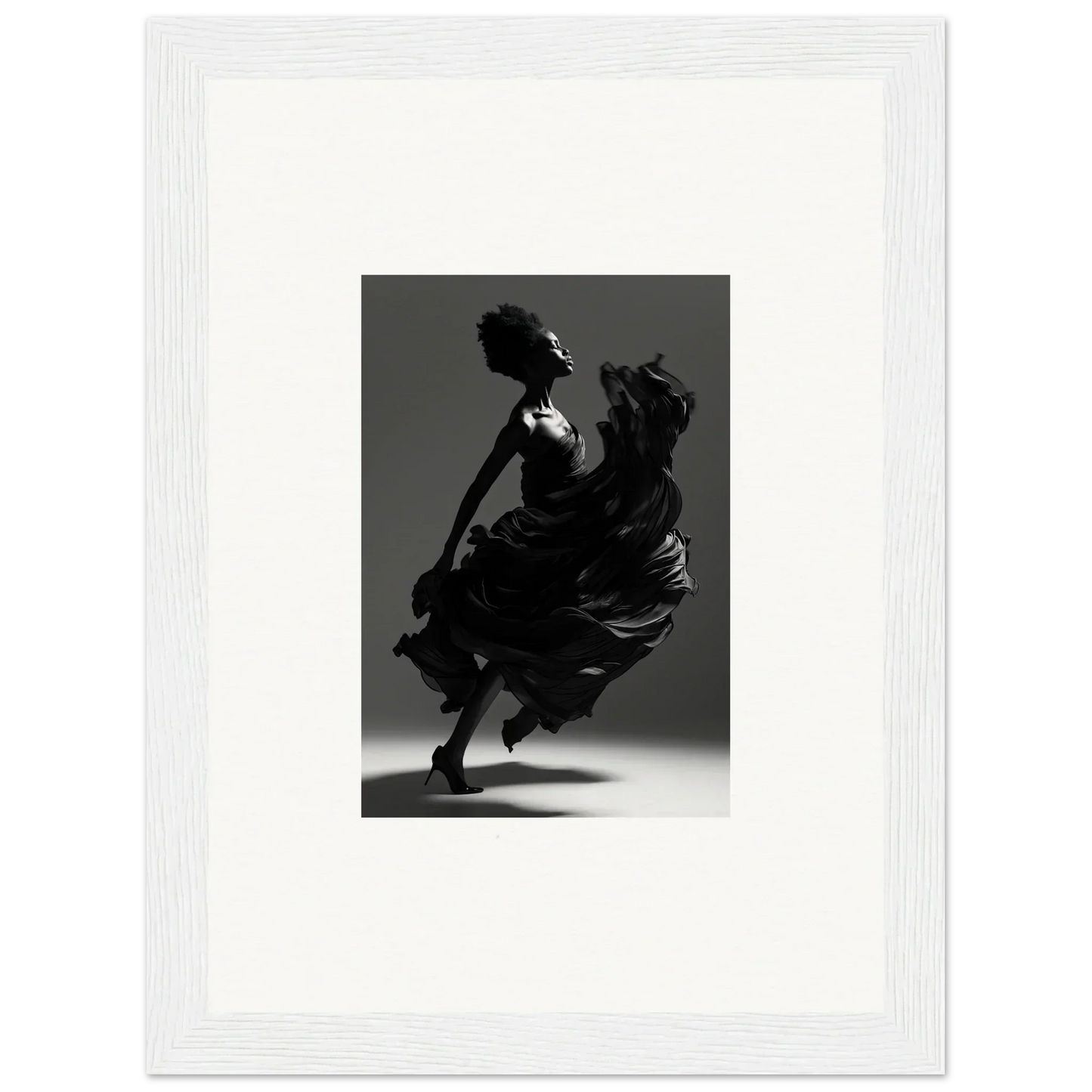 Silhouette of a dancer in a flowing dress, captured mid-twirl.