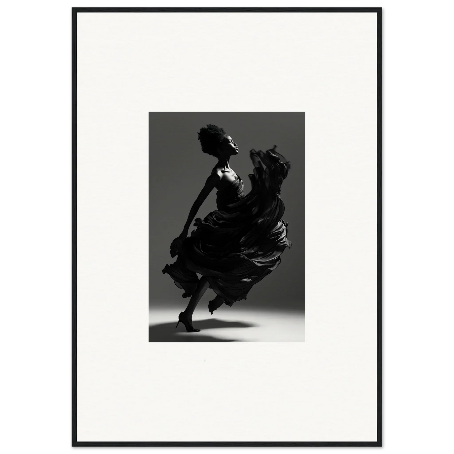 Silhouette of a dancer in a flowing dress captured mid-twirl.