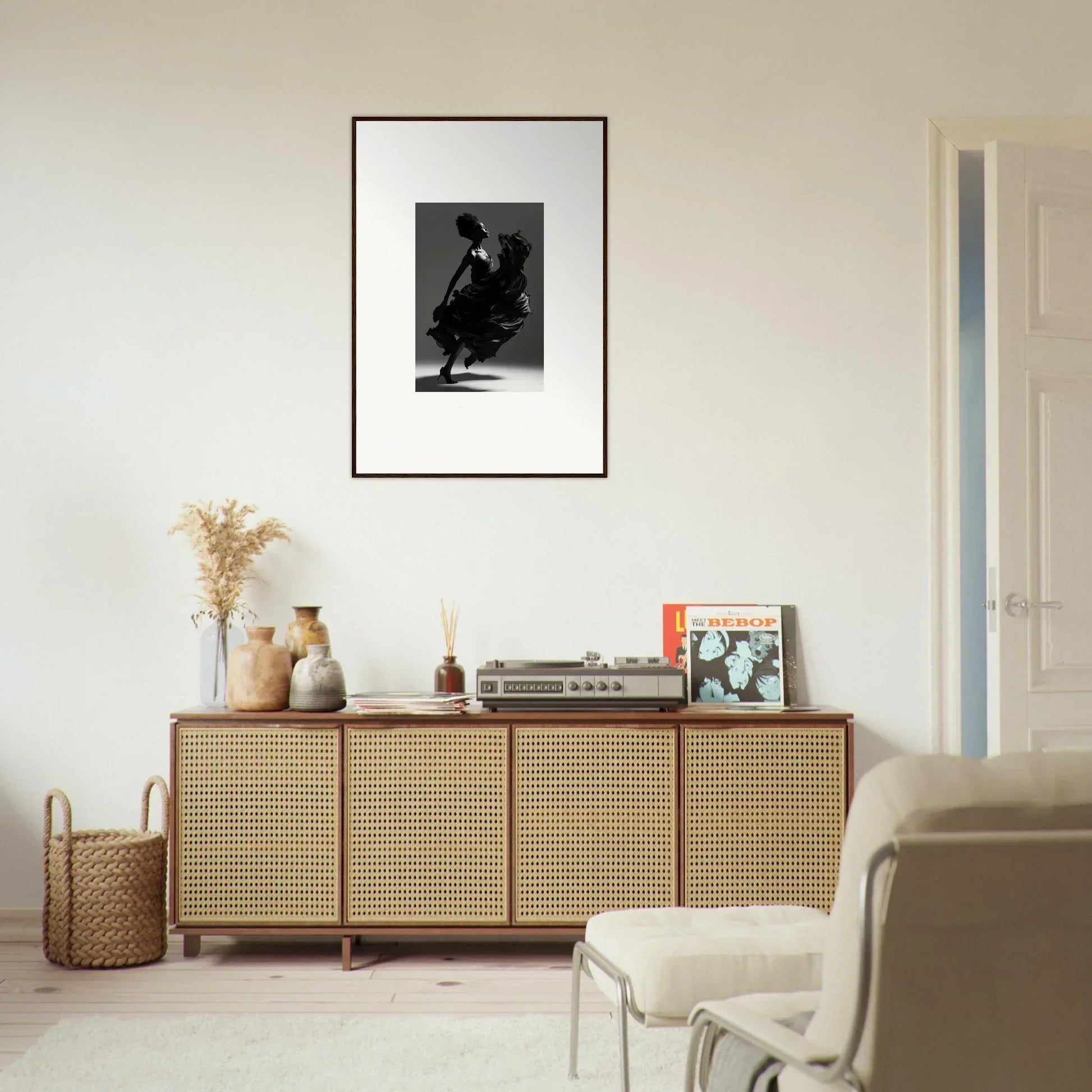 Wooden sideboard with cane-webbed doors and decorative items on top.