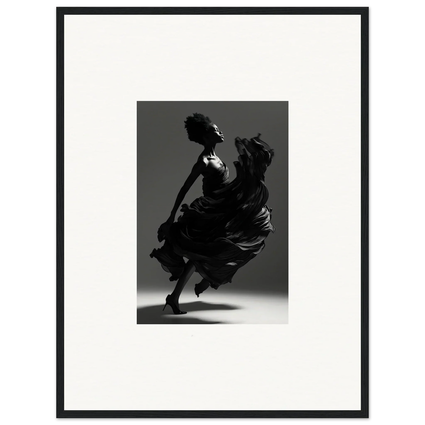 Silhouette of a dancer in a flowing dress captured mid-motion.