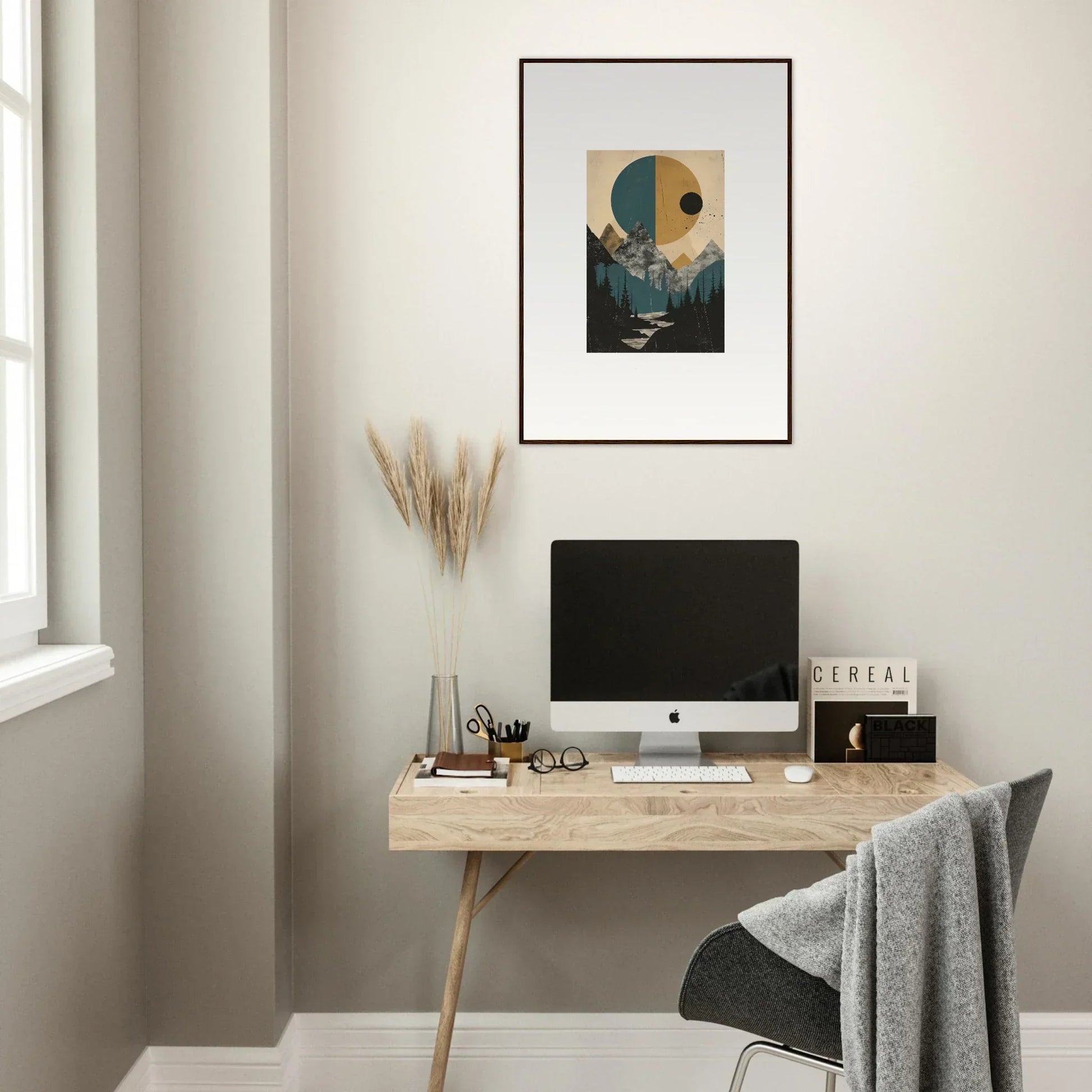 Minimalist home office with wooden desk, computer, and framed wall art in Eclipse Oasis